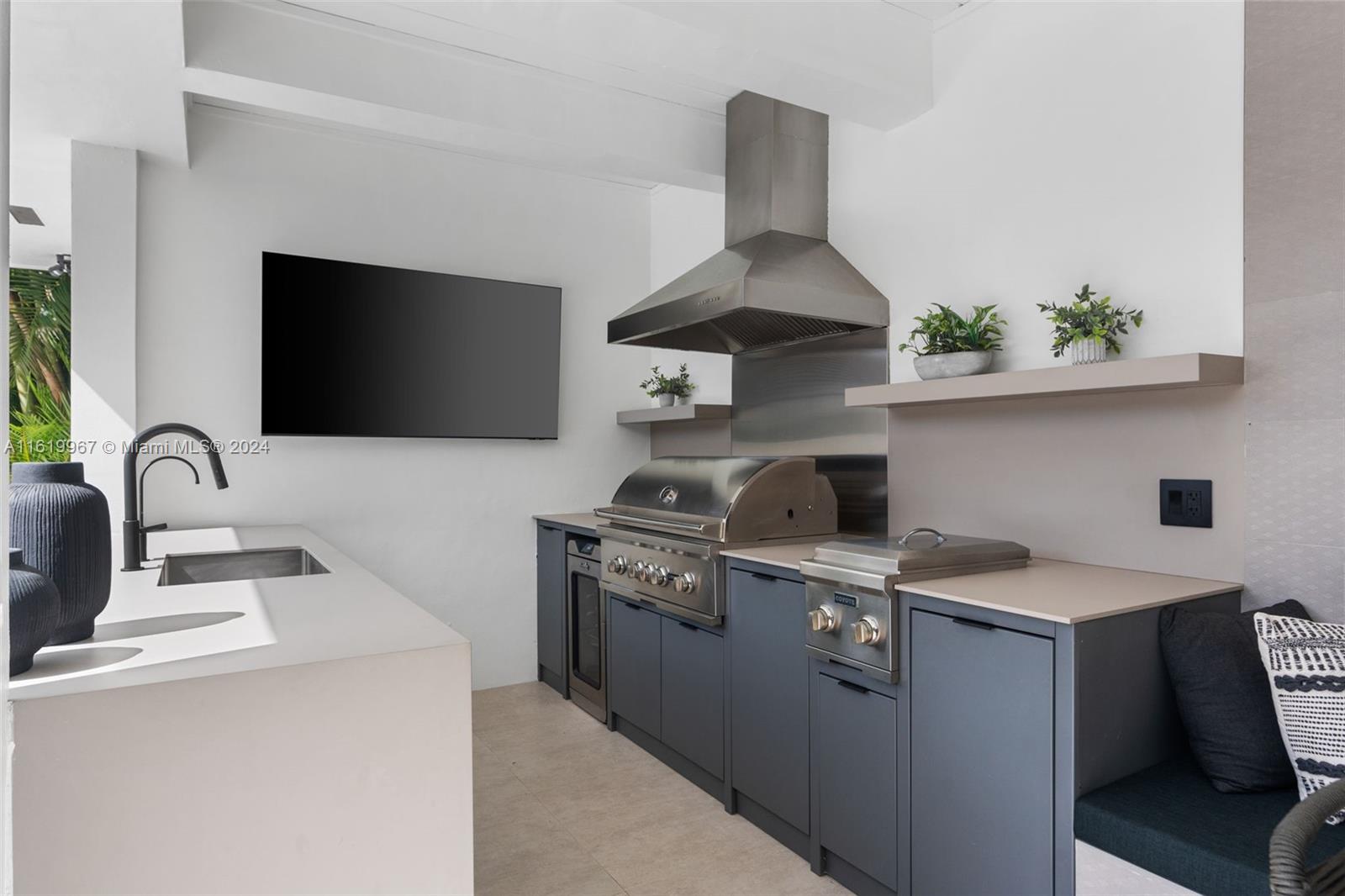 4800 Bay Point Road Miami, FL 33137 - Photo 49 of 74 a view of a kitchen with a sink and a stove