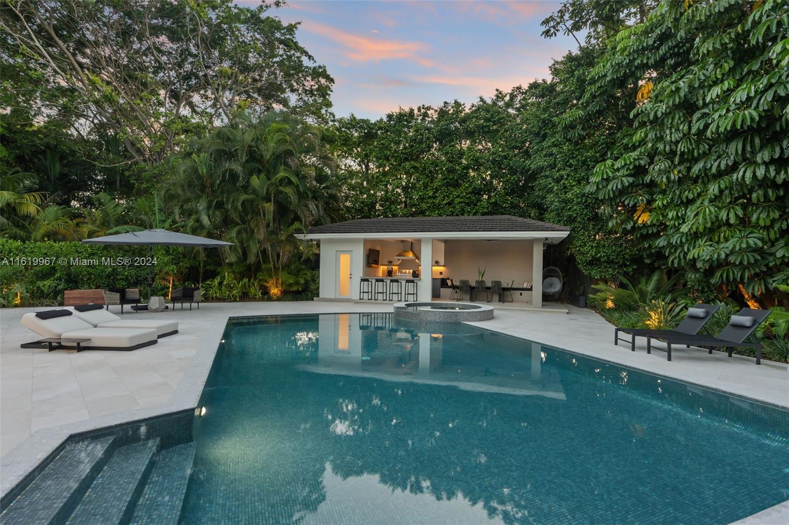4800 Bay Point Road Miami, FL 33137 - Photo 5 of 74 a view of house and outdoor space with swimming pool