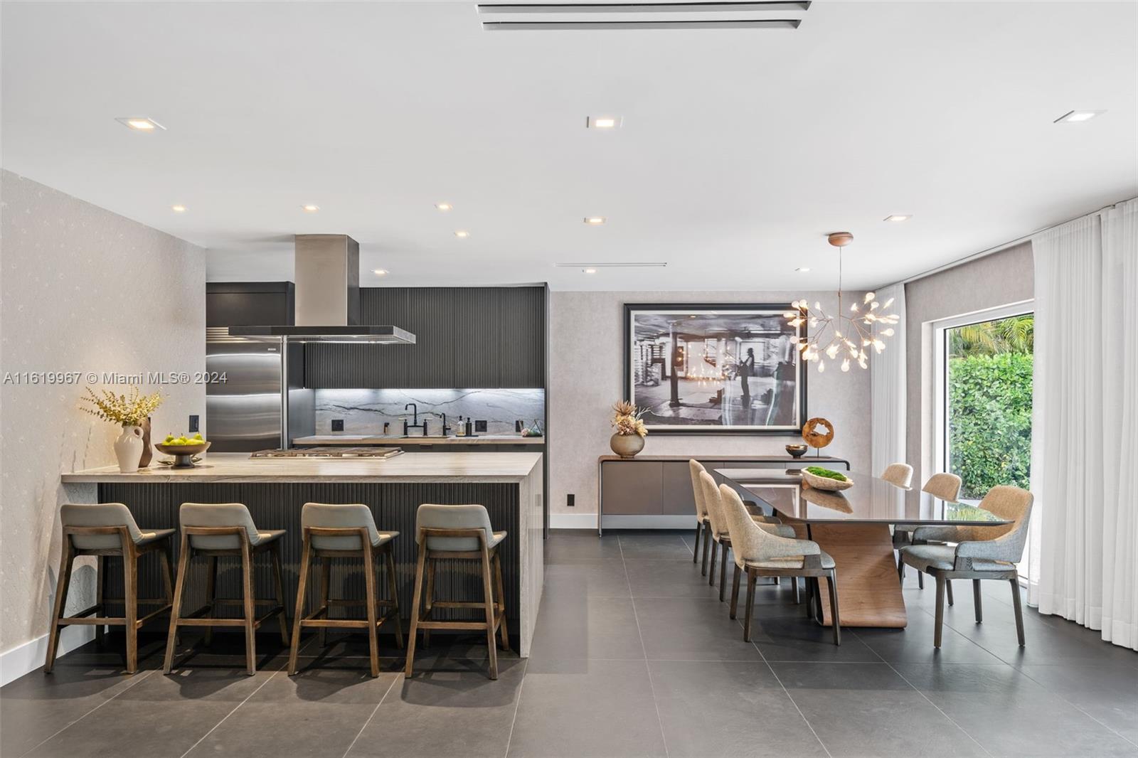 4800 Bay Point Road Miami, FL 33137 - Photo 7 of 74 a large kitchen with a table and chairs