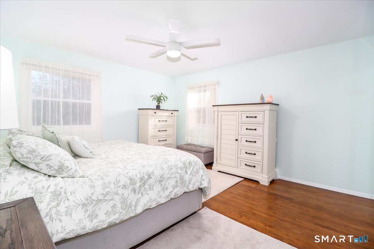 156 Stadley Rough Road Danbury, CT 06811 - Photo 18 of 32 Spacious primary bedroom with hardwood floors