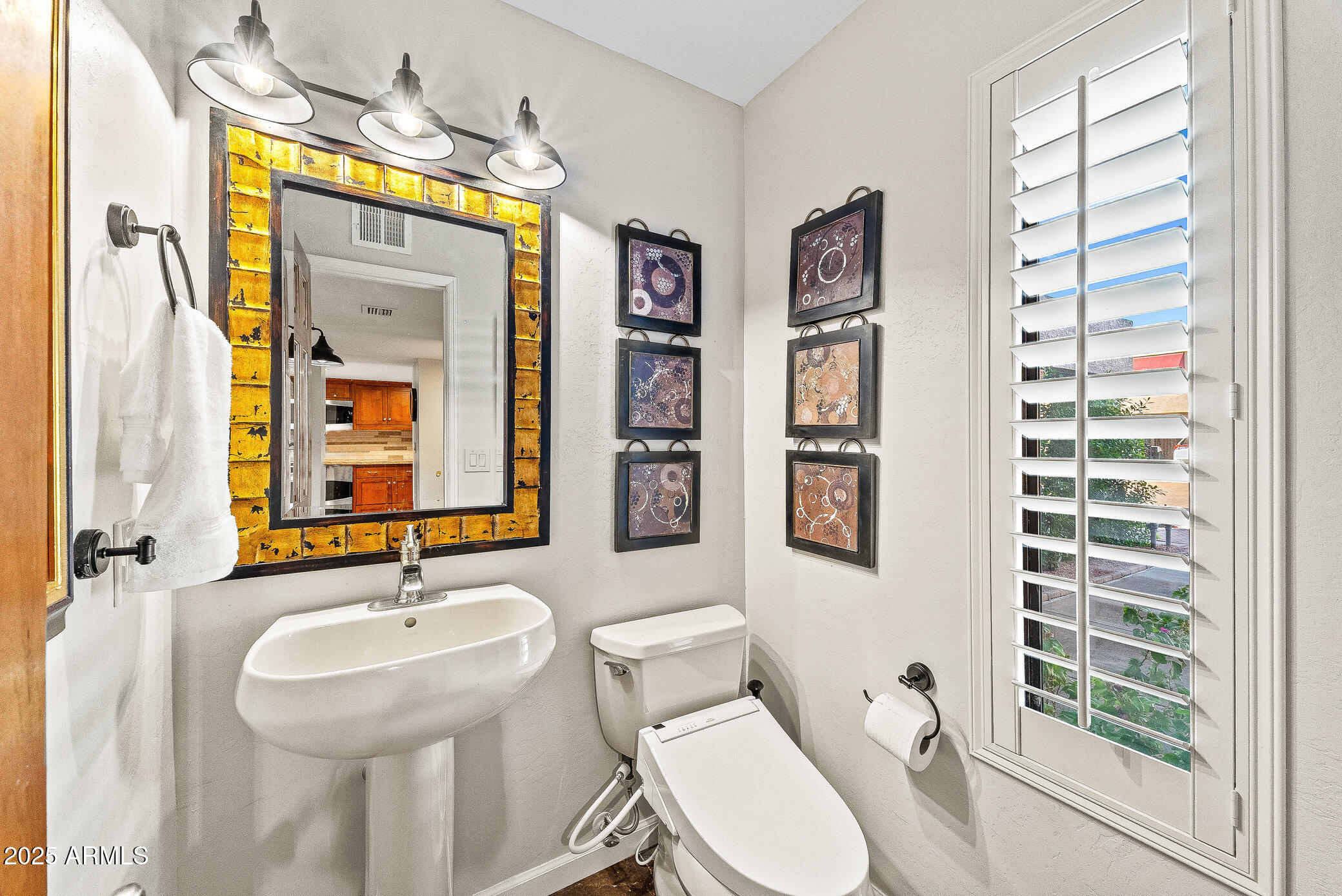 6159 East Indian School Road, Unit 104 Scottsdale, AZ 85251 - Photo 12 of 24 a bathroom with a sink and a mirror