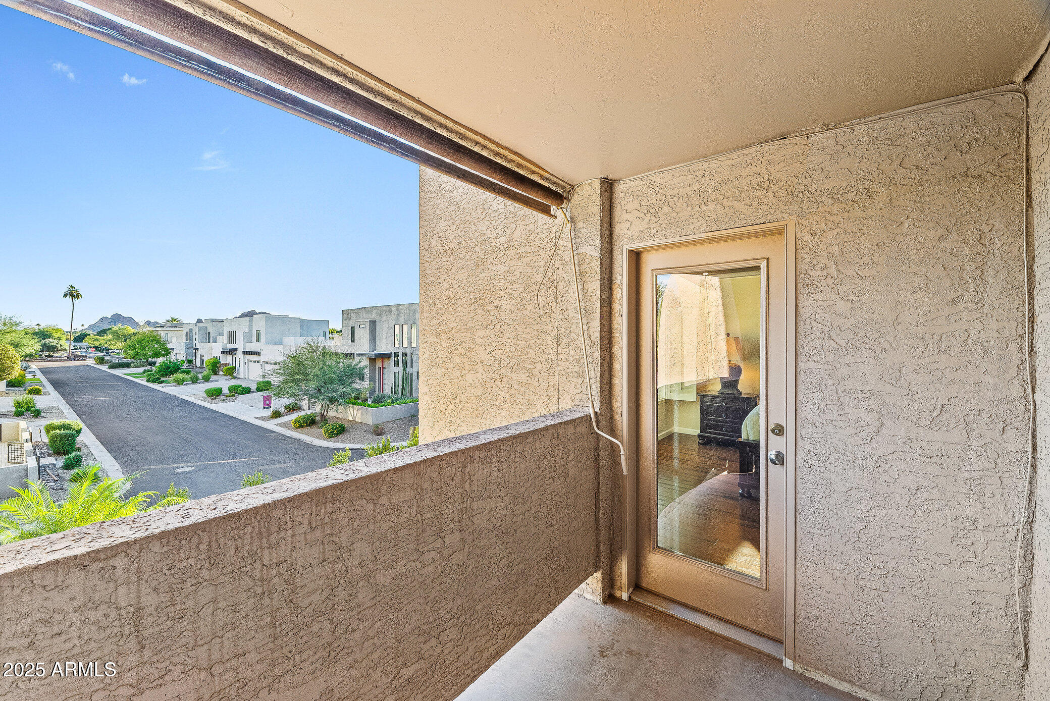 6159 East Indian School Road, Unit 104 Scottsdale, AZ 85251 - Photo 19 of 24 a view of a balcony and a couch