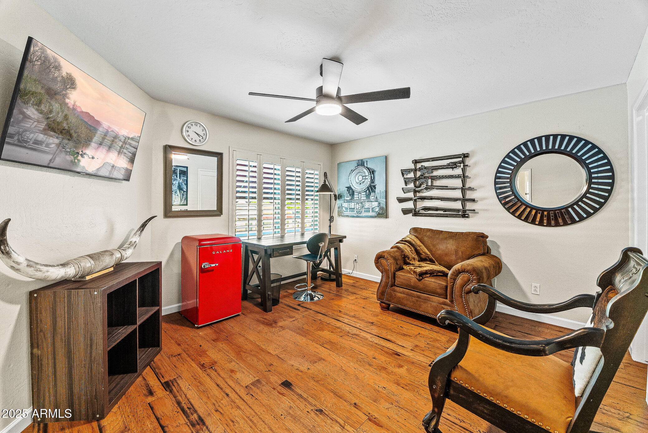 6159 East Indian School Road, Unit 104 Scottsdale, AZ 85251 - Photo 20 of 24 a bedroom with furniture and a window