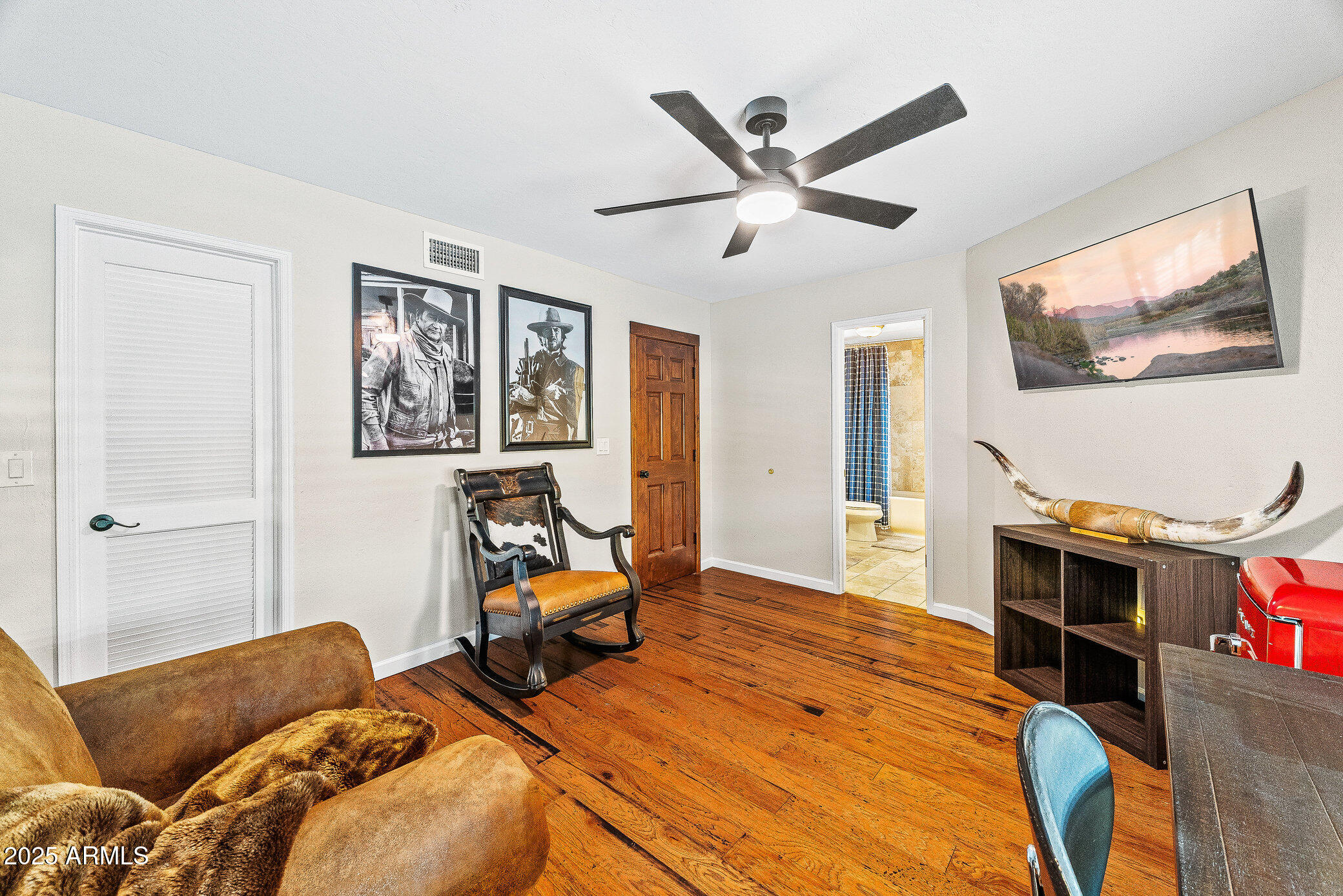 6159 East Indian School Road, Unit 104 Scottsdale, AZ 85251 - Photo 21 of 24 a living room with furniture and a flat screen tv