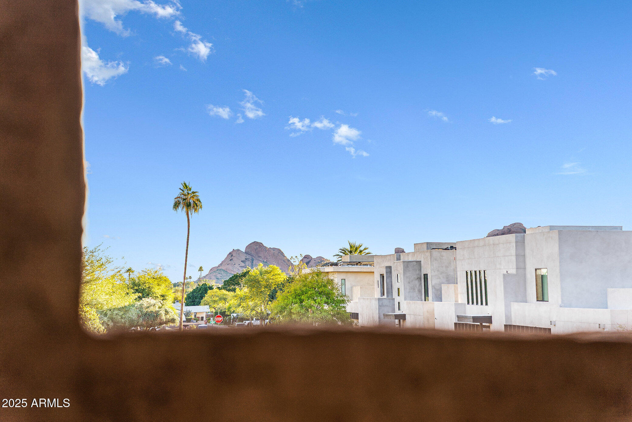 6159 East Indian School Road, Unit 104 Scottsdale, AZ 85251 - Photo 24 of 24 a view of a street with a building in the background