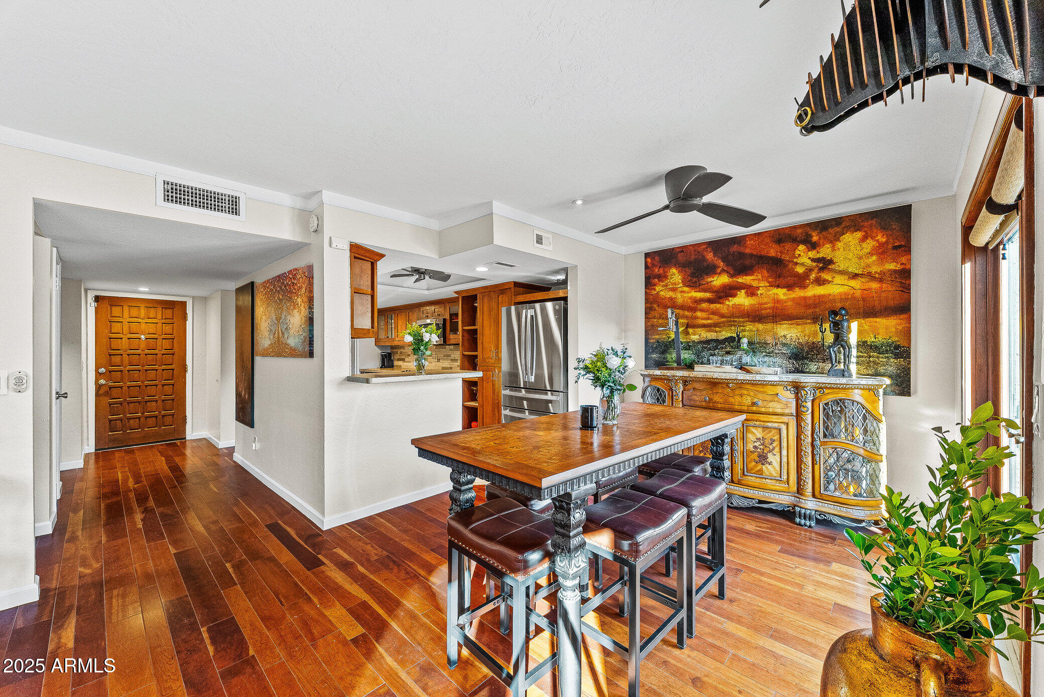 6159 East Indian School Road, Unit 104 Scottsdale, AZ 85251 - Photo 4 of 24 a dining room with a table and chairs