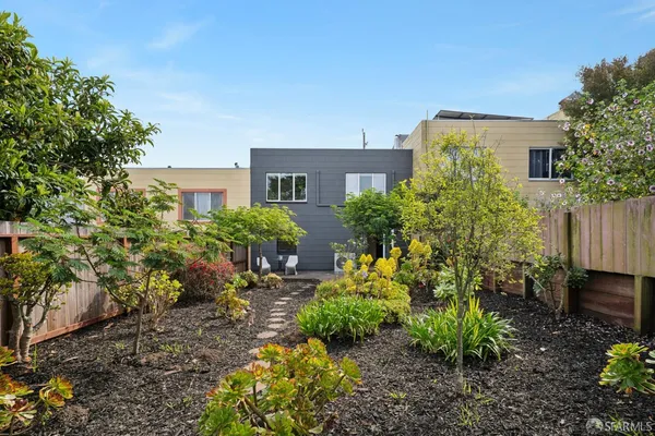 a view of multiple houses with a yard