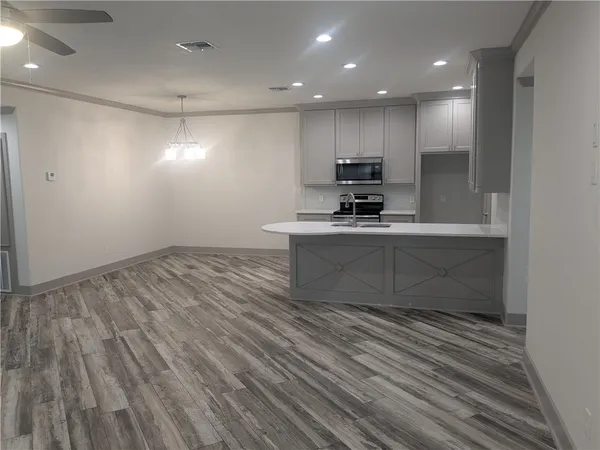 a view of kitchen with microwave and stove