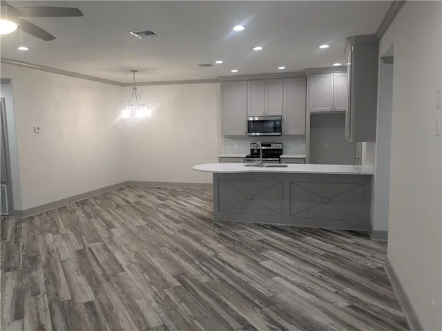 a view of kitchen with microwave and stove