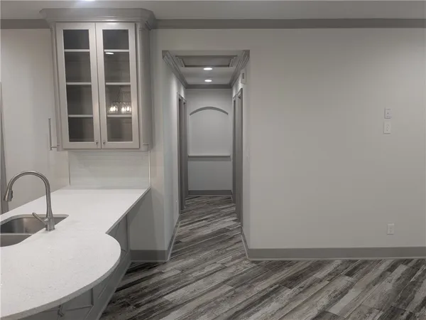 a bathroom with a sink and mirror