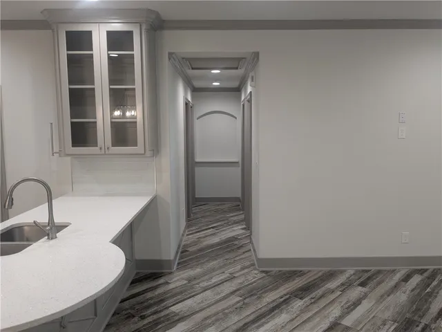 a bathroom with a sink and mirror