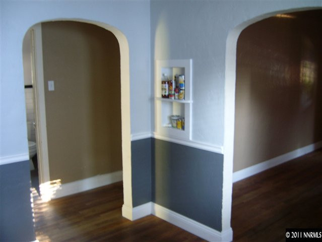 115 La Rue Avenue Reno, NV 89509 - Photo 4 of 12 an empty room with wooden floor closet and a window