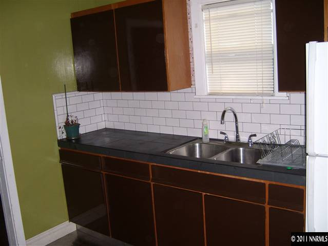 115 La Rue Avenue Reno, NV 89509 - Photo 6 of 12 a kitchen with a sink and cabinets