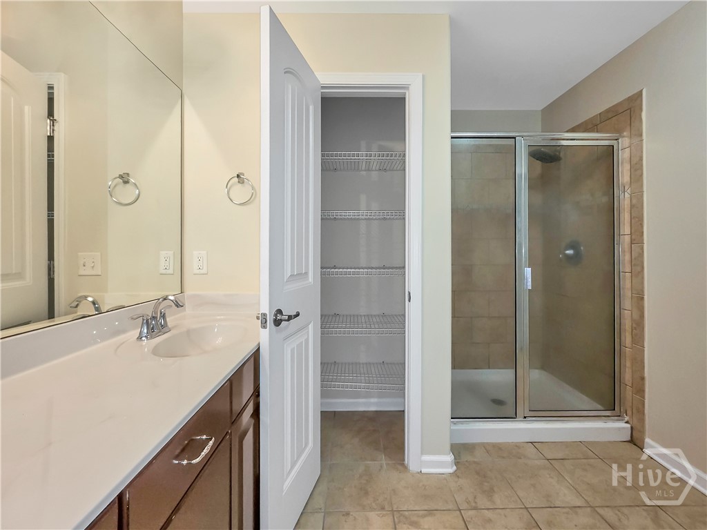 4 Melody Drive Pooler, GA 31322 - Photo 33 of 52 Primary Bathroom with double sinks, linen, and a tiled Walk-in shower