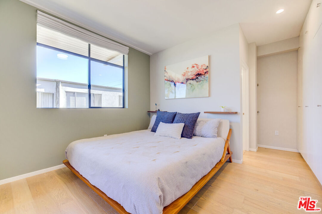 2902 Hemingway Drive Los Angeles, CA 90039 - Photo 16 of 25 a large bed sitting in a bedroom next to a window