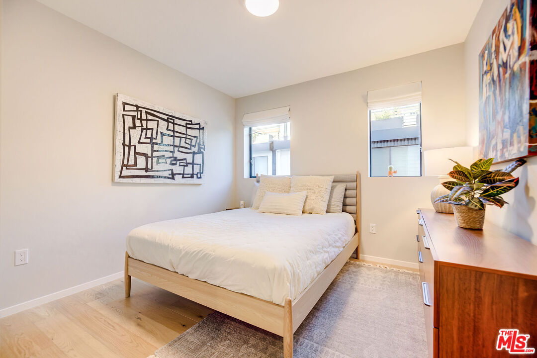 2902 Hemingway Drive Los Angeles, CA 90039 - Photo 18 of 25 a bedroom with a bed potted plant and a window
