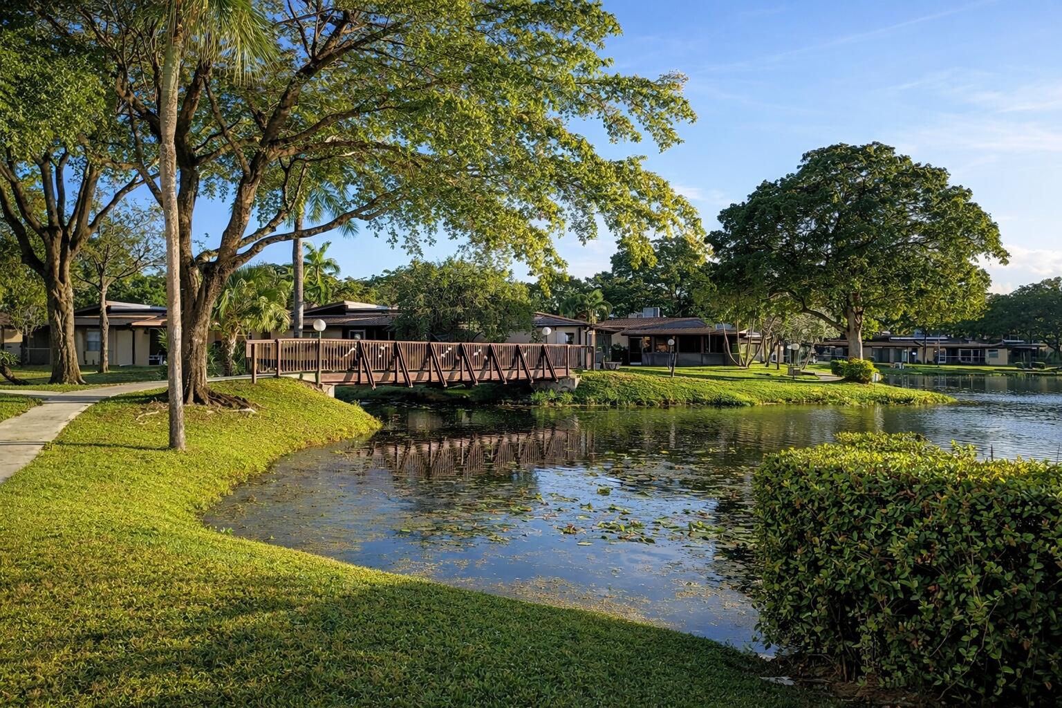 300 Berkley Road, Unit 112 Hollywood, FL 33024 - Photo 12 of 19 a view of a lake with a table and chairs
