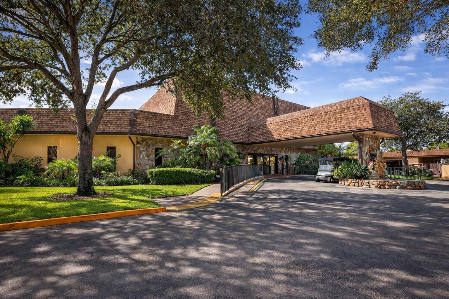 300 Berkley Road, Unit 112 Hollywood, FL 33024 - Photo 16 of 19 a view of outdoor space yard and tree
