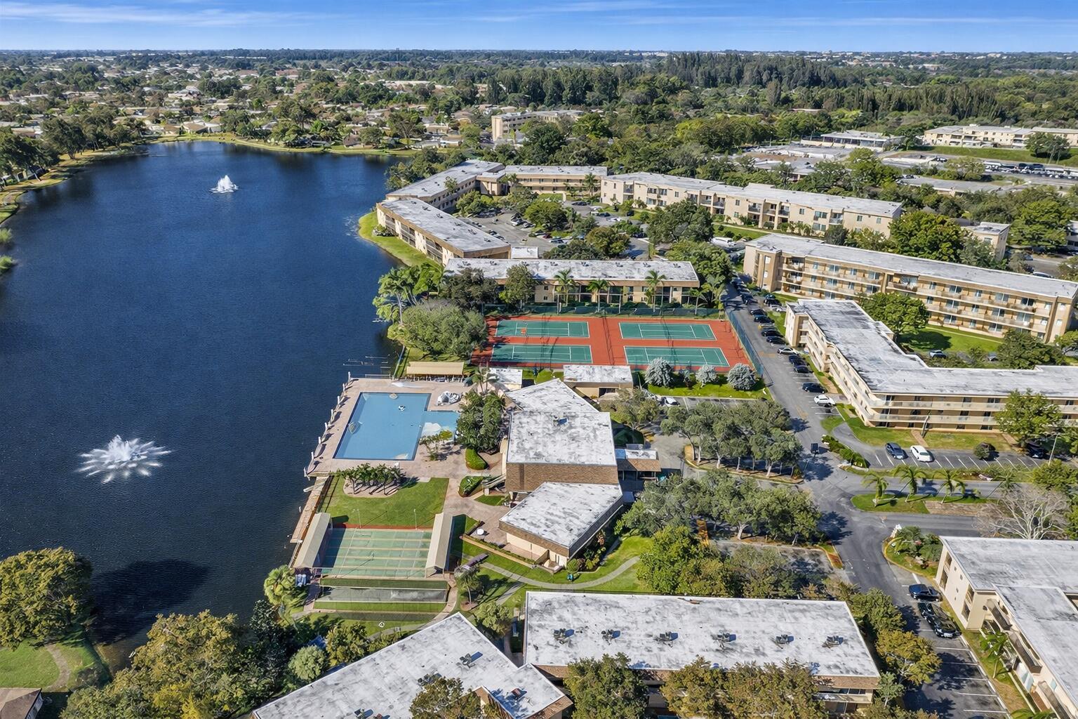 300 Berkley Road, Unit 112 Hollywood, FL 33024 - Photo 3 of 19 an aerial view of residential houses with outdoor space
