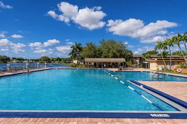 a view of a swimming pool with an outdoor seating