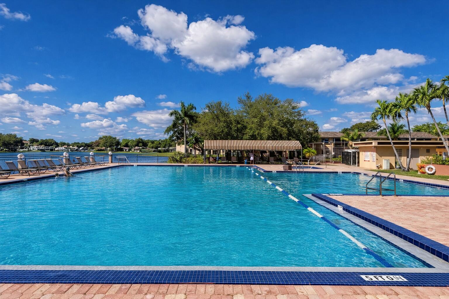 300 Berkley Road, Unit 112 Hollywood, FL 33024 - Photo 5 of 19 a view of a swimming pool with an outdoor seating