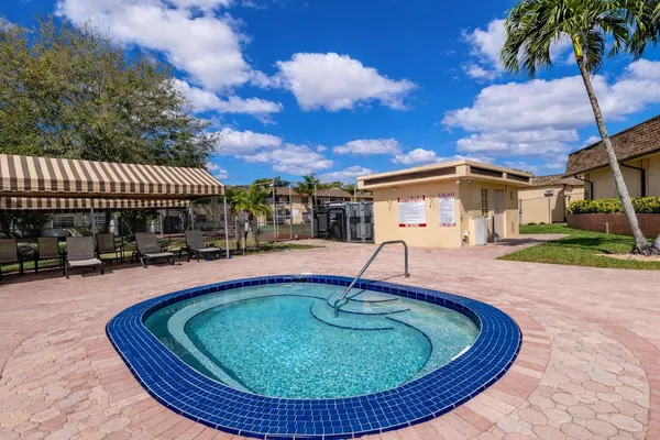 a view of a swimming pool with a patio