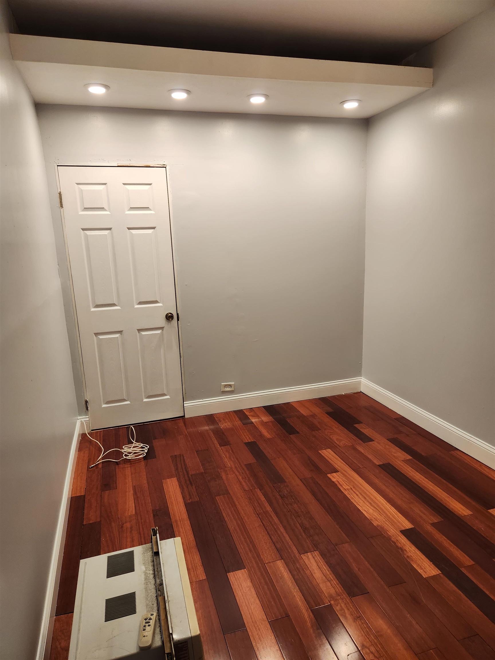 168 Fairview Avenue, Unit 1 Jersey City, NJ 07304 - Photo 15 of 17 a view of room with wooden floor