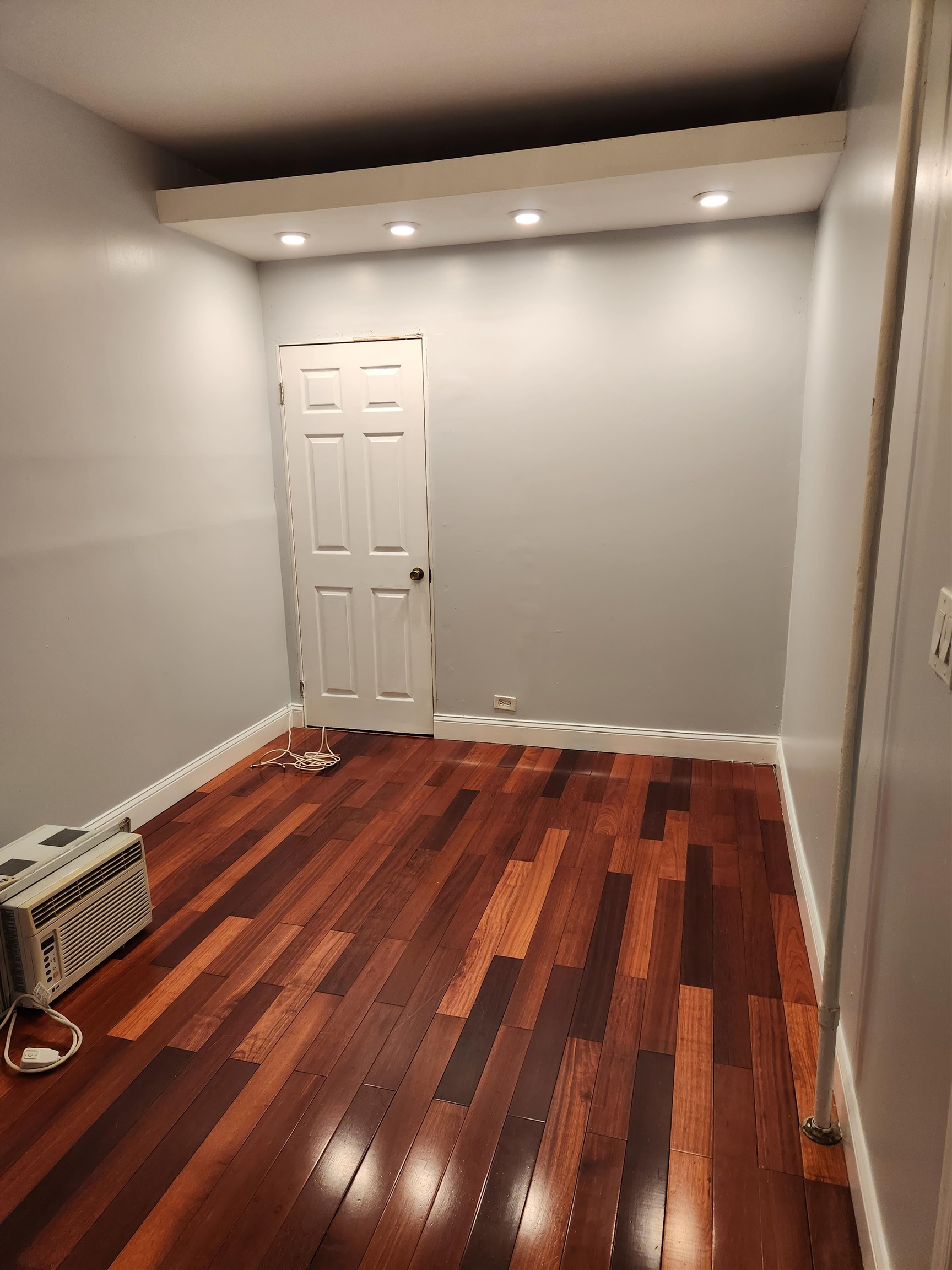 168 Fairview Avenue, Unit 1 Jersey City, NJ 07304 - Photo 16 of 17 a view of a room with wooden floor