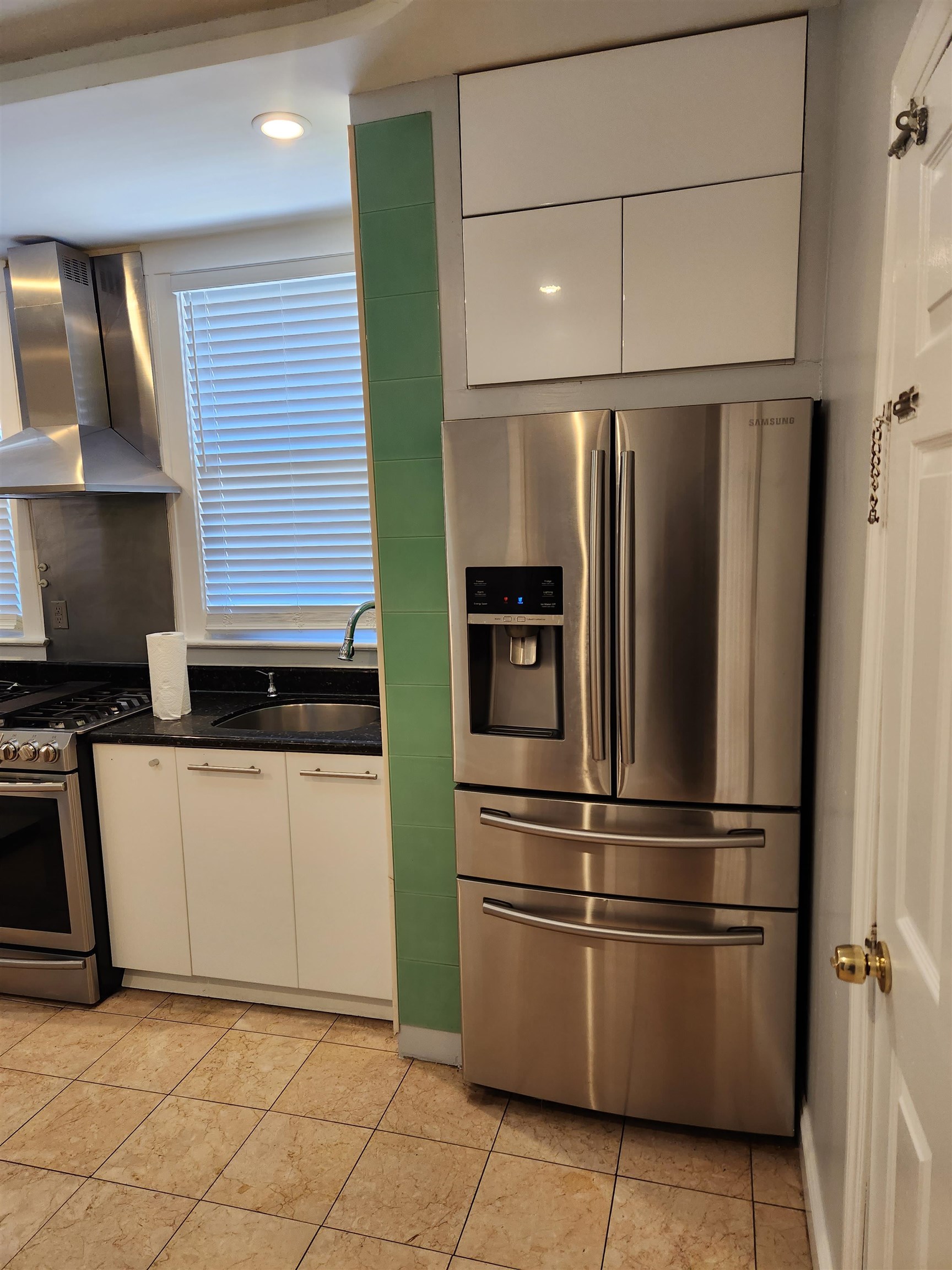 168 Fairview Avenue, Unit 1 Jersey City, NJ 07304 - Photo 4 of 17 a kitchen with stainless steel appliances granite countertop a refrigerator and a sink