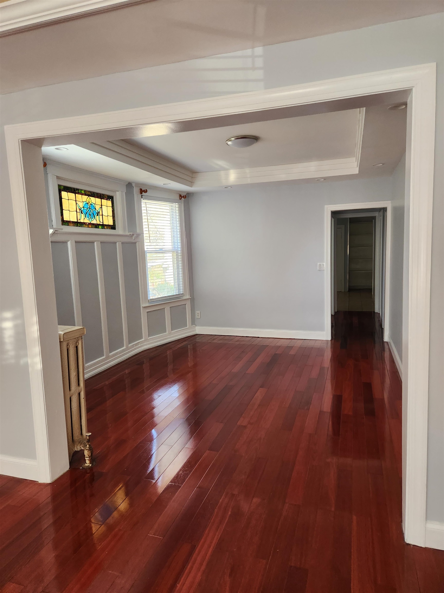168 Fairview Avenue, Unit 1 Jersey City, NJ 07304 - Photo 10 of 17 wooden floor in an empty room with a window