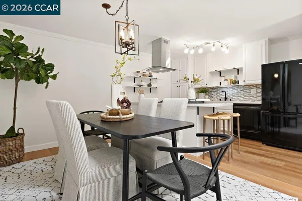 a bathroom with a granite countertop toilet sink and mirror