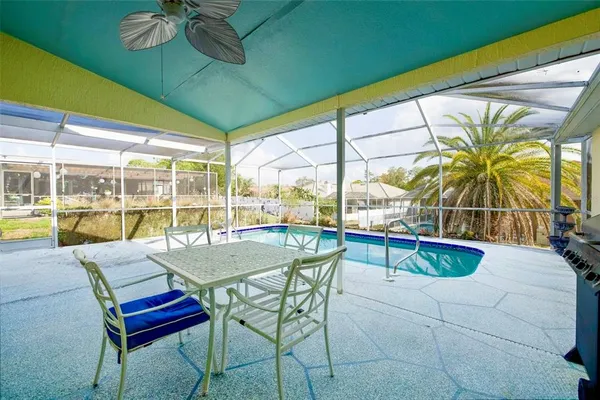 a dining room with furniture a chandelier and a rug