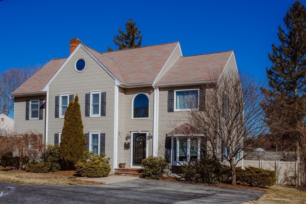 91 Brewster Road Waltham, MA 02451 - Photo 3 of 41 a view of a house with a yard