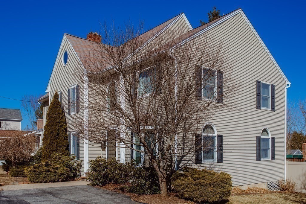 91 Brewster Road Waltham, MA 02451 - Photo 4 of 41 a view of a house with a yard