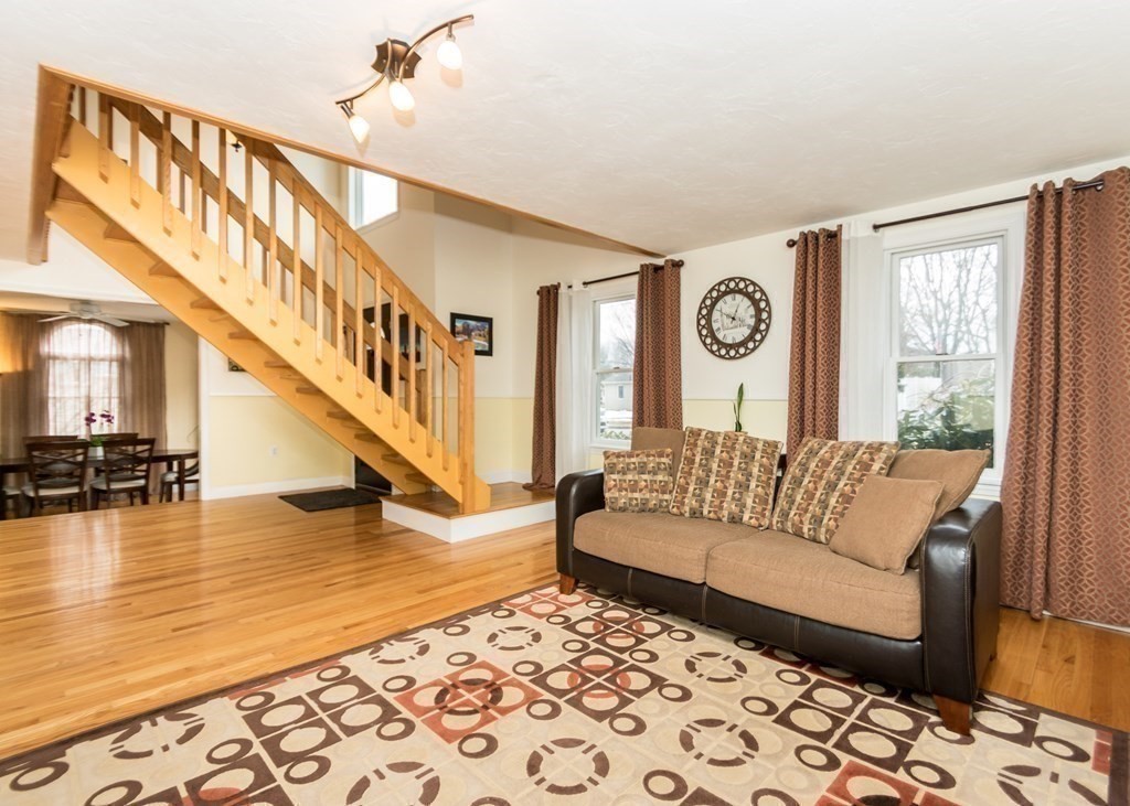 91 Brewster Road Waltham, MA 02451 - Photo 10 of 41 a living room with furniture and wooden floor