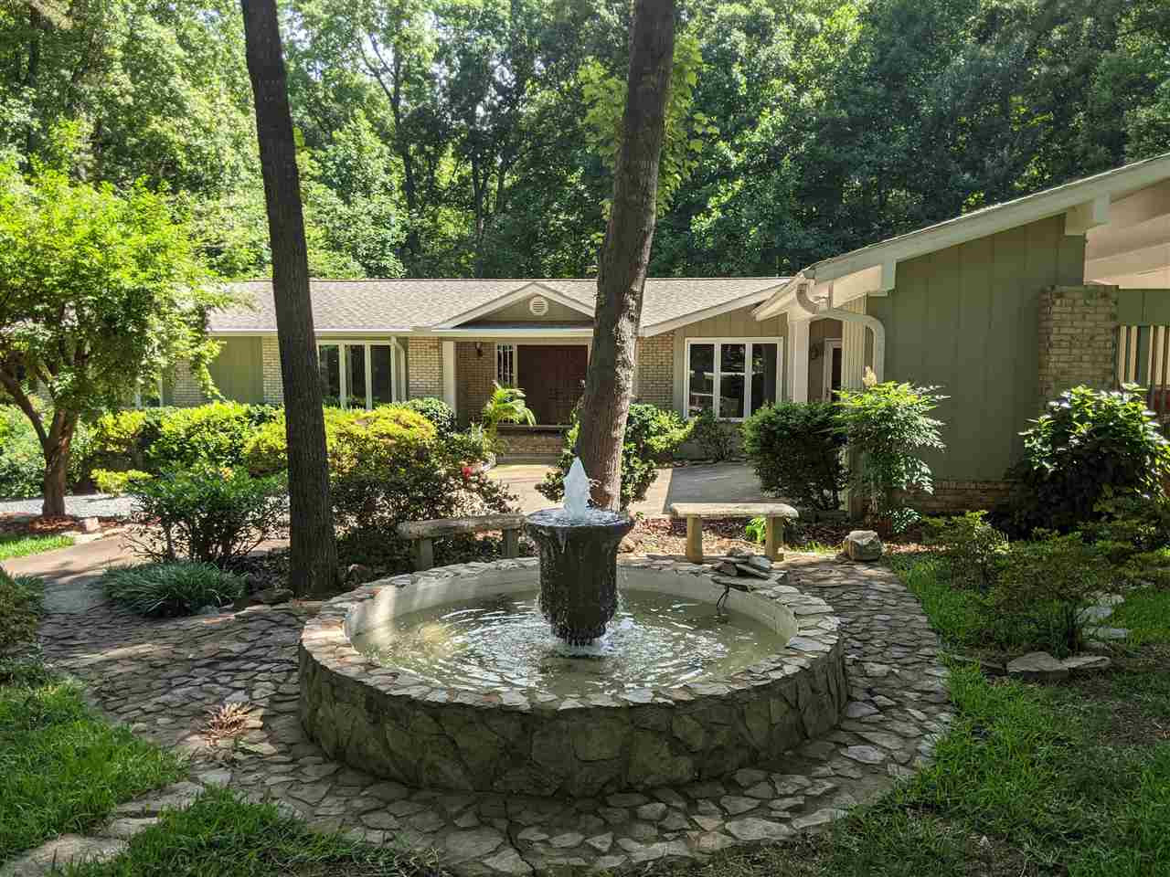 8529 Sawyer Drive Raleigh, NC 27613 - Photo 2 of 28 Beautiful water fountain in the front yard. The landscaping for this home is outstanding. Exterior Front