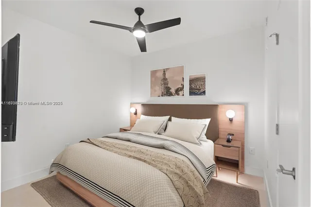 a bedroom with a bed and a painting on the wall