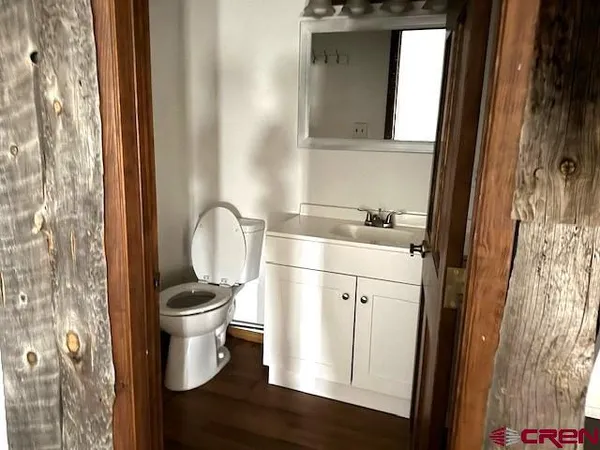 a bathroom with a toilet and a sink