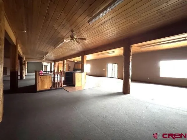 a view of an empty room with a fireplace