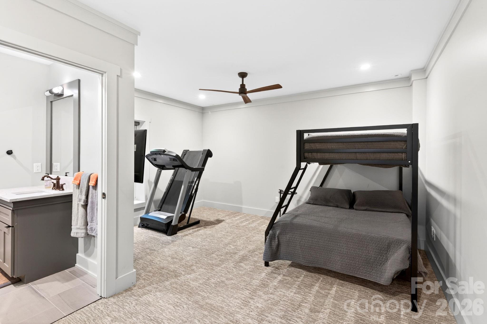 235 Bull Creek Road Asheville, NC 28805 - Photo 24 of 47 a room with gym equipment and a mirror