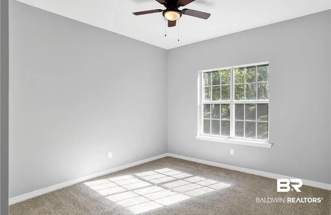 632 Ridgewood Drive Daphne, AL 36526 - Photo 26 of 36 Carpeted spare room featuring ceiling fan