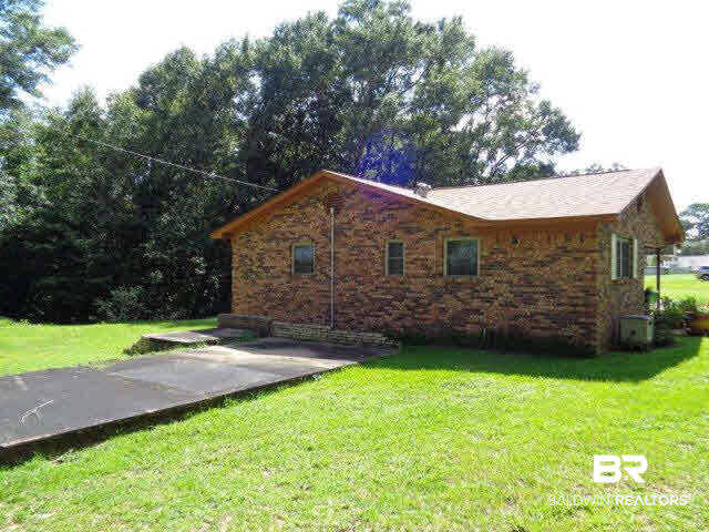 923 Martinville Loop Atmore, AL 36502 - Photo 8 of 24 this shows slab from original house on the site, makes great patio area.