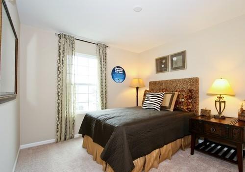 6358 Birmingham Street, Unit 104 Chicago Ridge, IL 60415 - Photo 6 of 8 a bedroom with a bed and a window