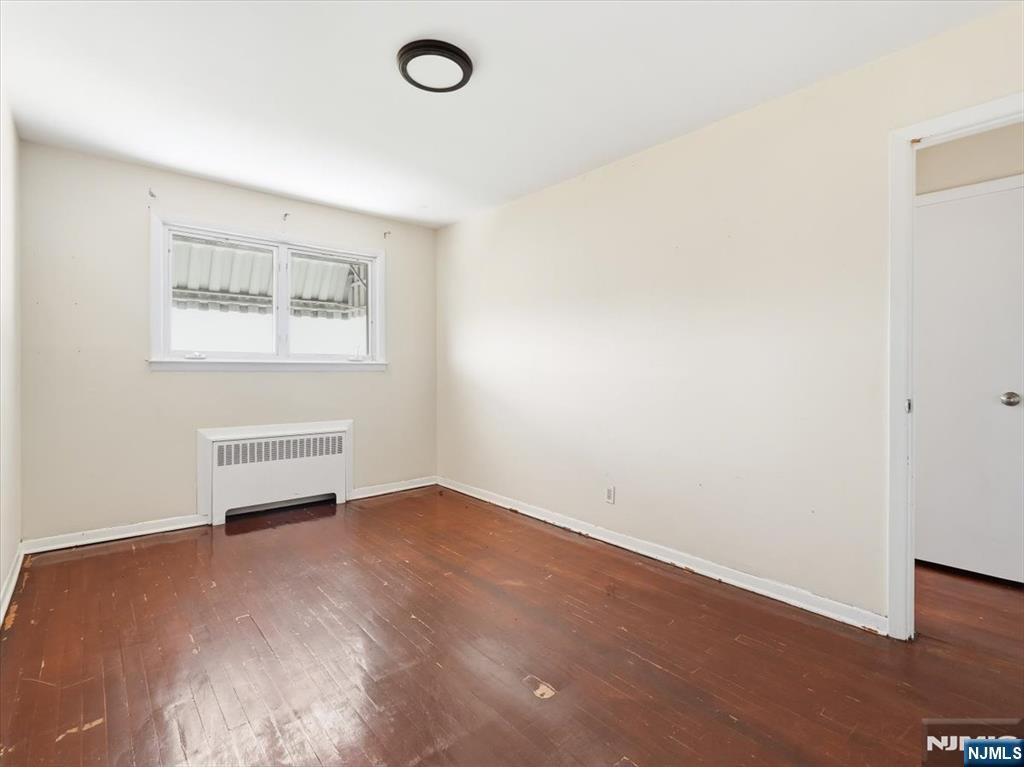648 Fairview Avenue, Unit 2 Fairview, NJ 07022 - Photo 11 of 17 an empty room with a workbench