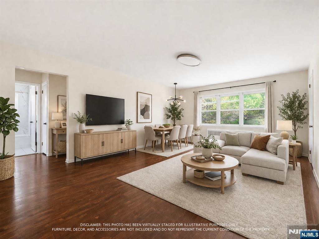 648 Fairview Avenue, Unit 2 Fairview, NJ 07022 - Photo 2 of 17 a living room with furniture and a flat screen tv