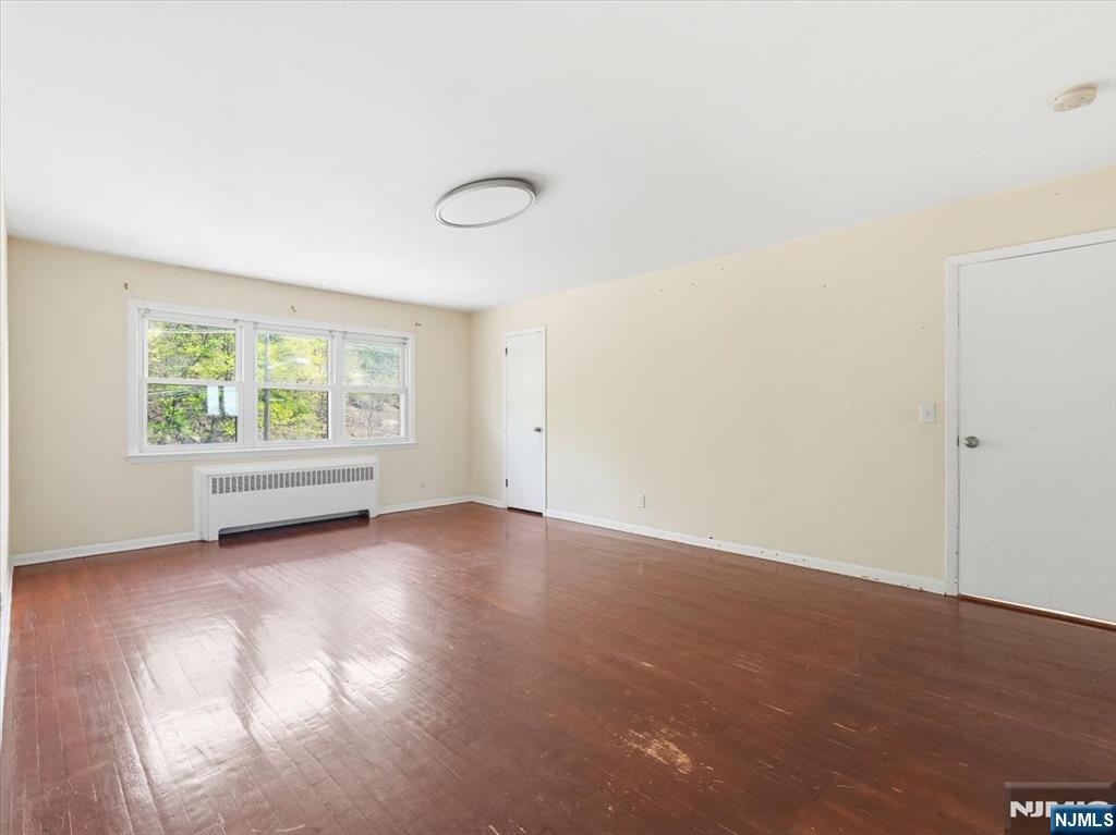648 Fairview Avenue, Unit 2 Fairview, NJ 07022 - Photo 8 of 17 an empty room with windows