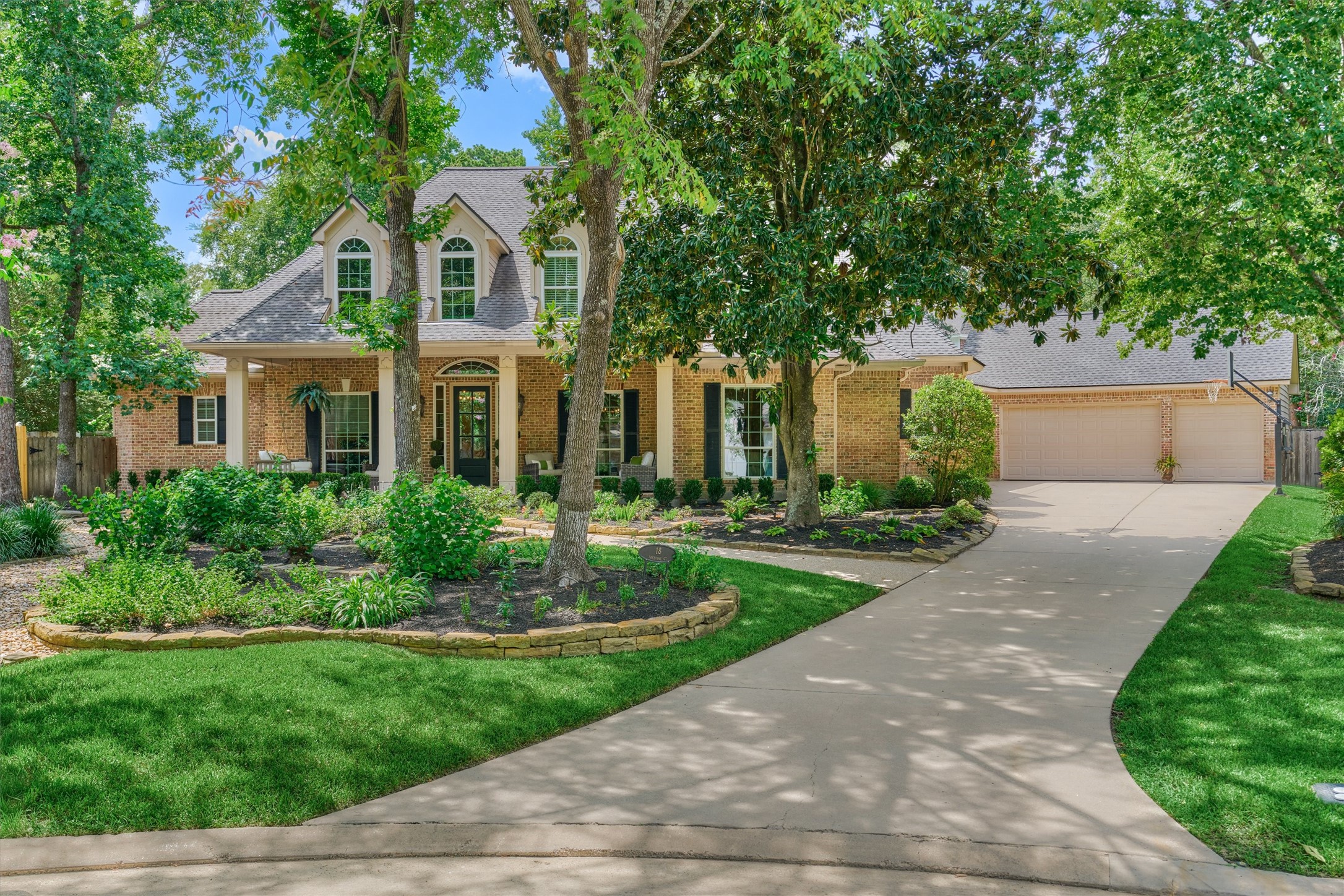 18 Treevine Court The Woodlands, TX 77381 - Photo 1 of 50 Palmer Woods gem showcasing classic Southern architecture and irresistible curb appeal on an oversized cul-de-sac lot!