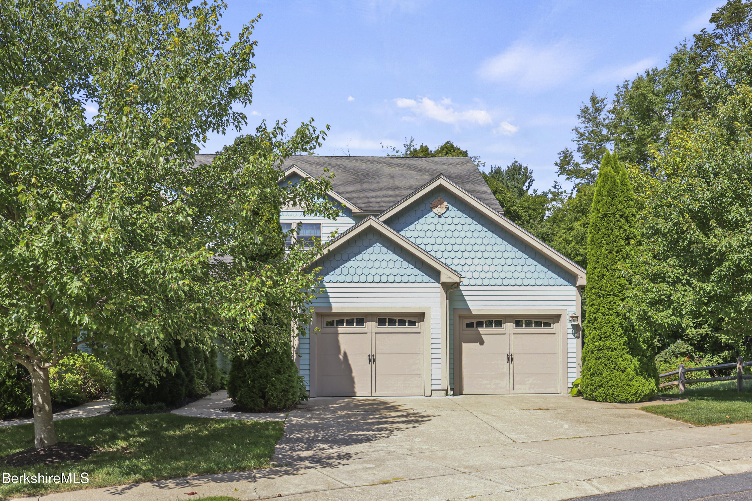 2 Amy Court, Unit 2 Pittsfield, MA 01201 - Photo 1 of 50 a view of a house with a yard and large tree