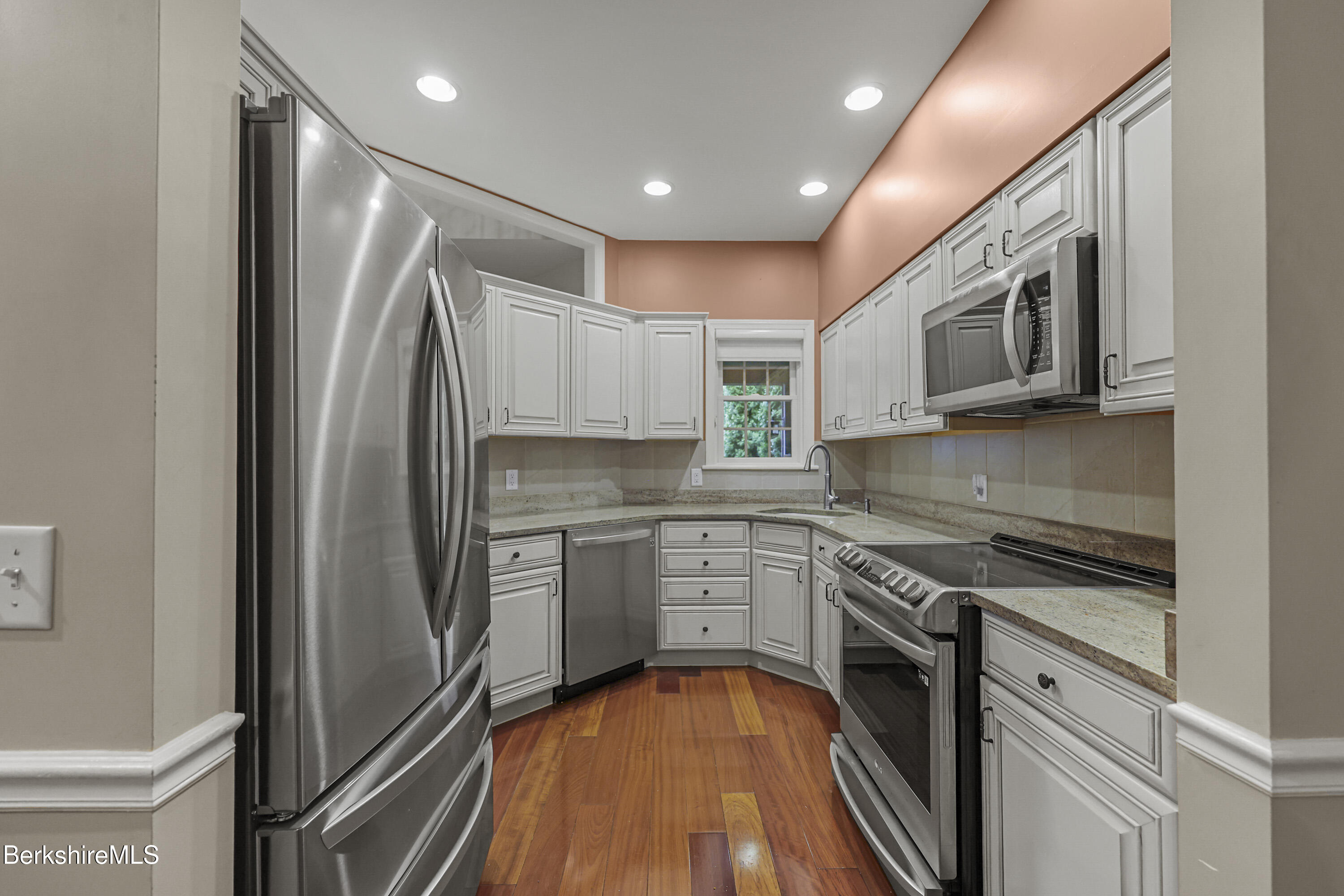 2 Amy Court, Unit 2 Pittsfield, MA 01201 - Photo 12 of 50 a kitchen with stainless steel appliances granite countertop a refrigerator a stove top oven and sink