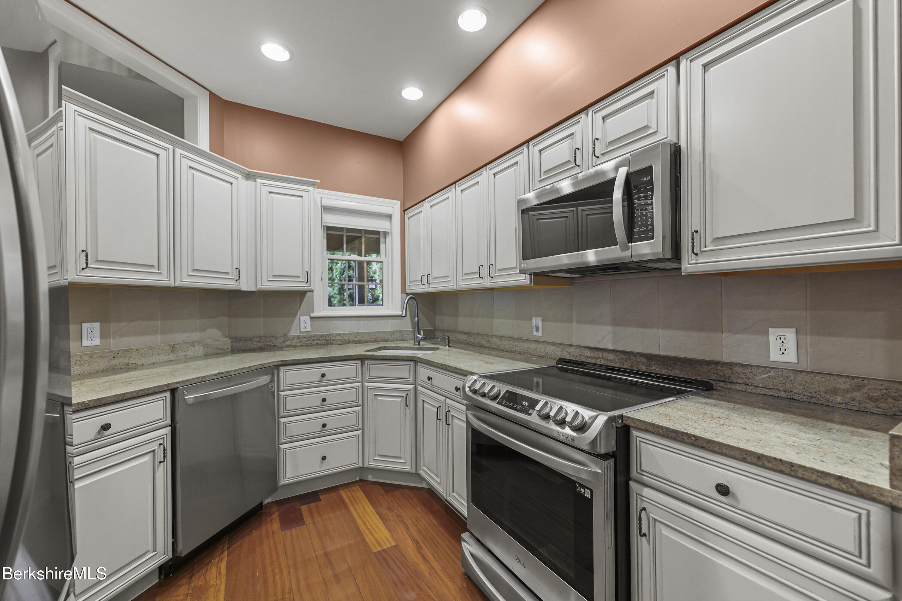 2 Amy Court, Unit 2 Pittsfield, MA 01201 - Photo 13 of 50 a kitchen with stainless steel appliances granite countertop a stove a microwave and cabinets
